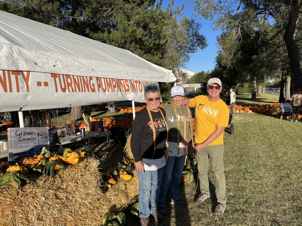 A few of our church members pose for a picture outside at a Habitat for Humanity pumpkin patch sale.