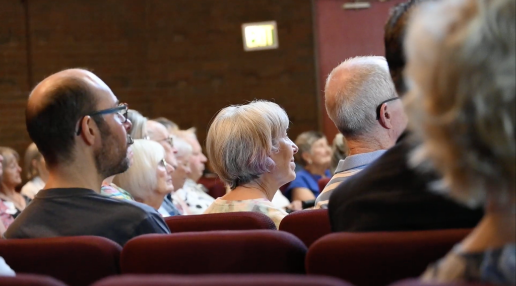 Common Flame congregants sit in the pews and listen to a sermon during a Sunday service.